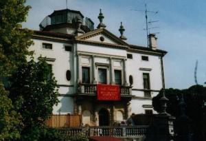 a large white building with a sign in front of it at Villa Gabriella B&B - Apartments in Venice-Lido +59 photos