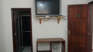 TV a/nebo společenská místnost v ubytování Casa Thayla Pousada