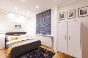 Ένα ή περισσότερα κρεβάτια σε δωμάτιο στο MW apartments