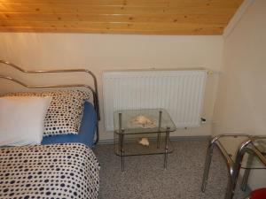 Posteľ alebo postele v izbe v ubytovaní Vakáció Apartman