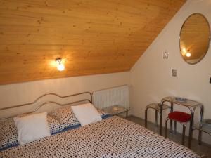 Posteľ alebo postele v izbe v ubytovaní Vakáció Apartman