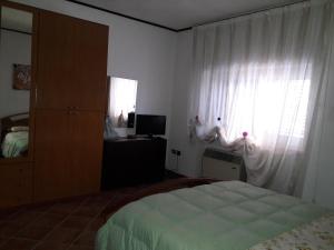 A bed or beds in a room at B&B Angels