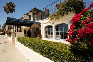 a building with flowers on the side of it at The Milo in Santa Barbara