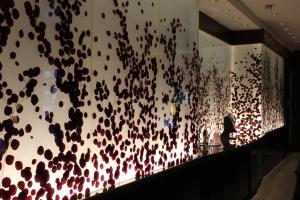 a room with a wall covered in black and white confetti at Luxury Suites International at The Signature in Las Vegas
