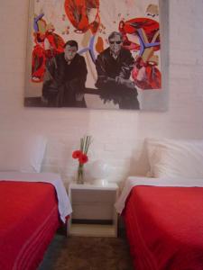 Palermo Viejo Bed & Breakfast tesisinde bir odada yatak veya yataklar