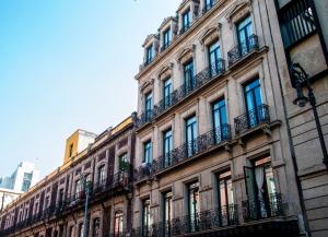 a large building with balconies on the side of it at Historico Central Hotel in Mexico City