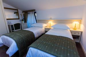 Postel nebo postele na pokoji v ubytování Guest House Šterk