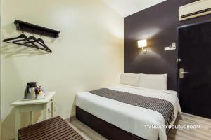 Postel nebo postele na pokoji v ubytování Ceria Hotel