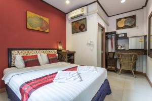 Postel nebo postele na pokoji v ubytování PloyKhumThong Boutique Resort + 37 fotografií