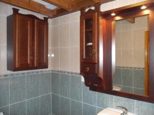 a bathroom with a sink and a mirror at Casa Villaverde in Covadonga