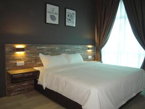 Postel nebo postele na pokoji v ubytování L Hotel