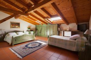 Rúm í herbergi á Agriturismo I Comelli