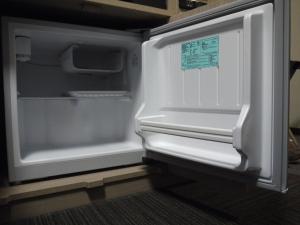 an empty refrigerator with its door open in a room at Hotel Route-Inn Kisarazu in Kisarazu