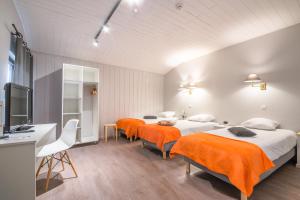 Cama o camas de una habitación en Mandarina Hotel Luxembourg Strassen