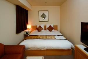 Postel nebo postele na pokoji v ubytování Hotel The Centre Utsunomiya