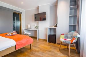 Cama o camas de una habitación en Mandarina Hotel Luxembourg Strassen