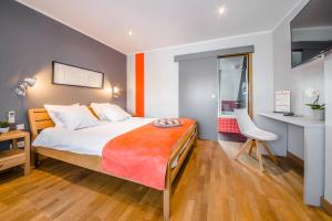 Cama o camas de una habitación en Mandarina Hotel Luxembourg Strassen