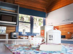 a kitchen with a tea pot and a cup on a counter at Artee House - A Bright Escape in Bright