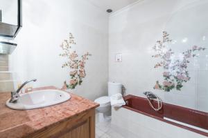 a bathroom with a sink and a toilet at Villa COLLIN - Promenade des Anglais in Nice