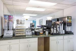 a kitchen with a counter top with a coffee maker at Howard Johnson by Wyndham Virginia Beach in Virginia Beach