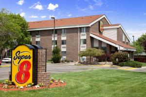 a super sign in front of a hotel at Super 8 by Wyndham Westminster Denver North in Westminster