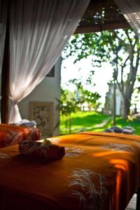 a close up of a bed in a bedroom at Avillion Villa Cinta @Sanur, Bali in Sanur