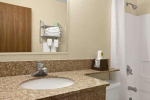 a bathroom with a sink in a hotel room at Quality Inn in Jackson