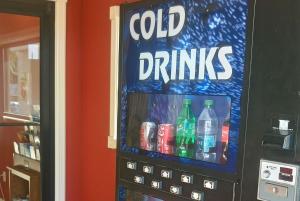 an old drink vending machine with cold drinks on it at Super 8 by Wyndham Dover in Dover