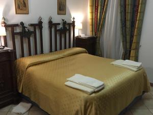 Krevet ili kreveti u jedinici u objektu La Residenza dei Nobili