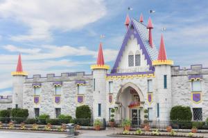 a castle building with red and purple turrets at Red Carpet Inn Lancaster in Lancaster
