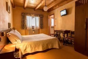 Säng eller sängar i ett rum på Hotel Punta Cian