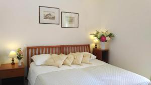 Postel nebo postele na pokoji v ubytování Hotel Villa Augustus
