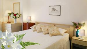 Postel nebo postele na pokoji v ubytování Hotel Villa Augustus