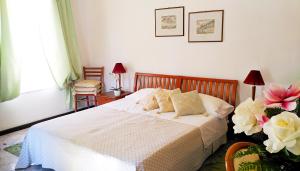 Postel nebo postele na pokoji v ubytování Hotel Villa Augustus