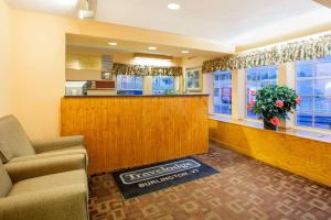 a waiting room at a fast food restaurant at Travelodge by Wyndham South Burlington in Burlington