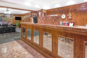 a bar in a lobby with wood at Knights Inn & Suites South Sioux City in South Sioux City