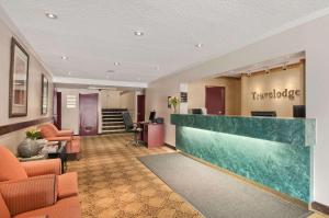 a lobby of a hotel with a reception desk at Travelodge by Wyndham Nanaimo in Nanaimo