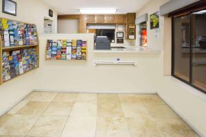 a store aisle with a counter in a pharmacy at Travelodge by Wyndham Indio in Indio