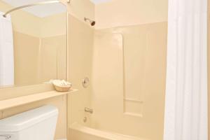 a bathroom with a shower, toilet and sink at Travelodge by Wyndham Mill Valley/Sausalito in Mill Valley