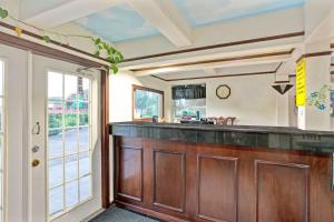 a kitchen with a counter and a window at Super 8 by Wyndham La Marque TX/Texas City Area in La Marque