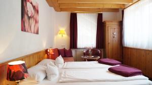 Postel nebo postele na pokoji v ubytování Hotel Schwarzenbergs Traube
