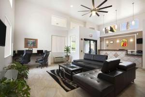 a living room with a couch and a table at Super 8 by Wyndham Marana/Tucson Area in Tucson