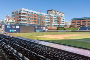 a view of a baseball field at a stadium at Super 8 by Wyndham Durham/University Area NC in Durham
