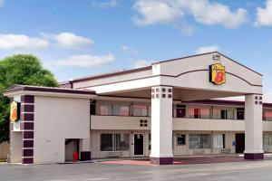 a fast food building with a krispy kreme at Super 8 by Wyndham Oklahoma/Frontier City in Edmond