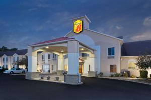 a mcdonalds restaurant with a sign on top of it at Super 8 by Wyndham Cloverdale IN in Cloverdale