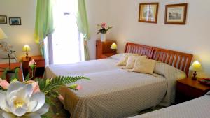 Postel nebo postele na pokoji v ubytování Hotel Villa Augustus