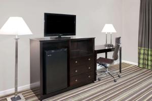 A television and/or entertainment centre at Super 8 by Wyndham Morton Grove/Chicago