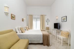 Postel nebo postele na pokoji v ubytování Sunrise Apartment I