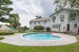 a swimming pool in the yard of a house at Travelodge by Wyndham Great Barrington Berkshires in Great Barrington