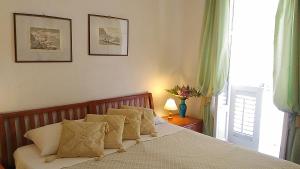 Postel nebo postele na pokoji v ubytování Hotel Villa Augustus
